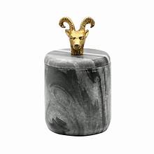 Gray marble container with brass ram handle